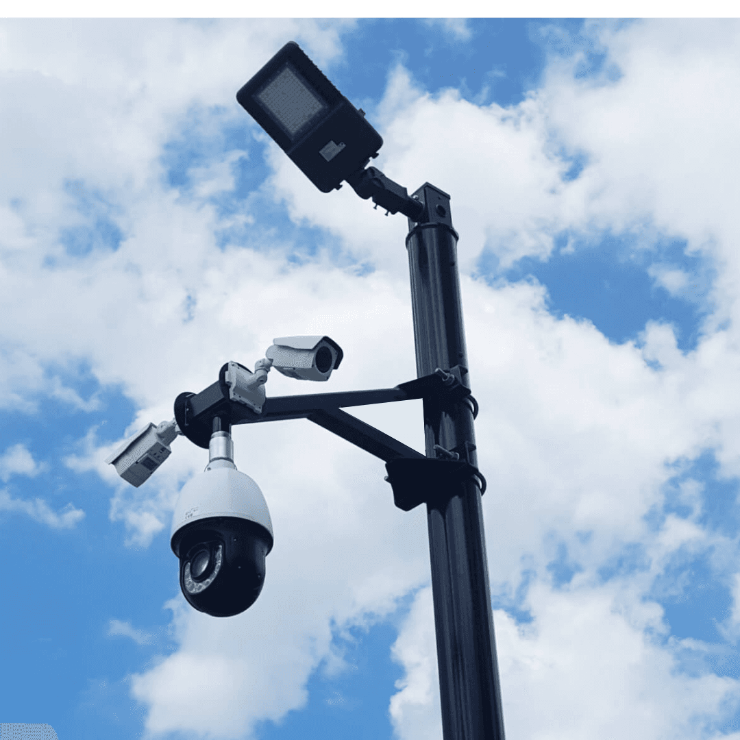 Security camera mast with floodlight
